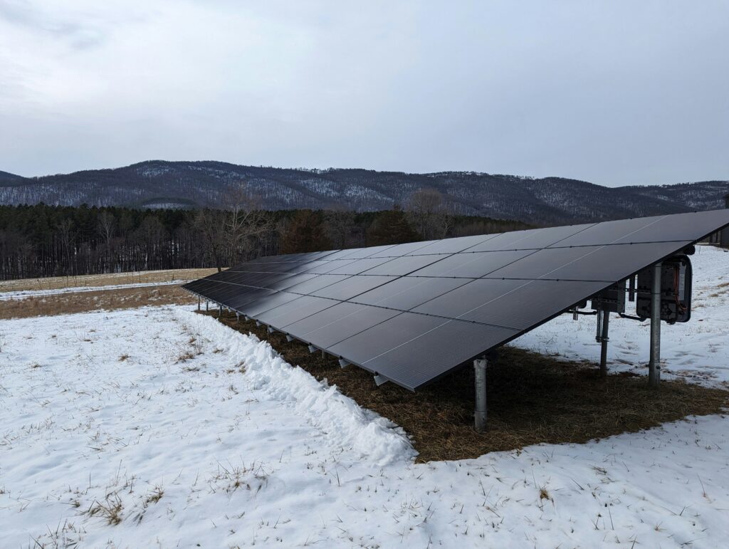 Solar panel installation in a snowy field in Pennsylvania representing renewable energy in the state